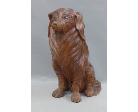 Carved wood model of a seated dog, 43cm 