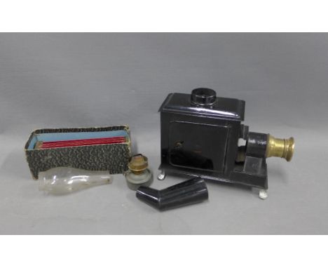 German tin plate Magic Lantern and a small collection of coloured glass slides 
