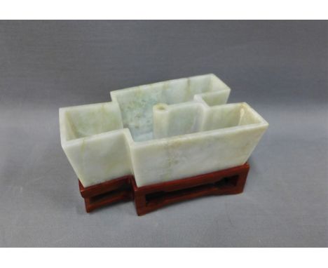 Jade brush washer of geometric form, on a wooden stand, 13cm