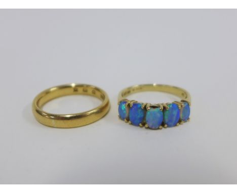 18ct gold wedding band and a 9ct gold opal dress ring, both size O (2) 