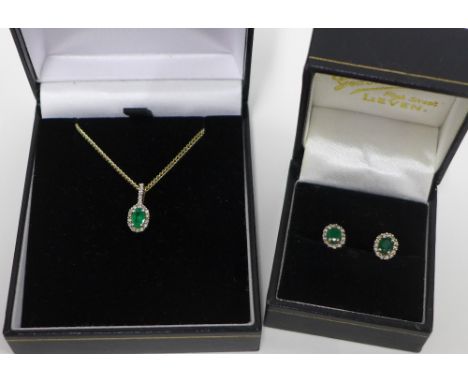 9ct gold emerald and diamond pendant on a yellow metal chain together with a pair of matching earrings (2) 