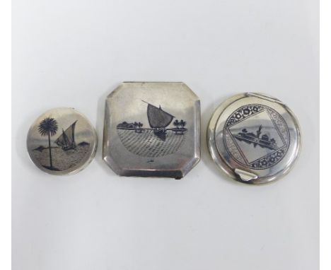 Two Eastern white metal and niello powder compacts and a similar trinket box (3) 