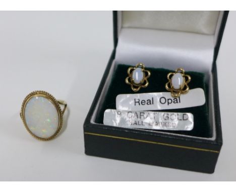 9ct gold opal dress ring, size N, and a pair of 9ct gold opal stud earrings (2) 