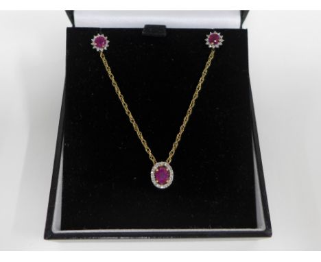 9ct gold ruby and diamond pendant on a 9ct gold chain together with a pair of 9ct gold ruby and diamond earrings (2) 