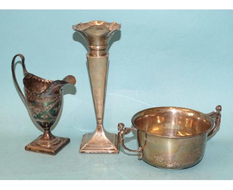 A George V Mappin &amp; Webb silver porringer with two winged cherub handles, 10cm diameter, 15 x 10cm overall, 5.5cm high, S