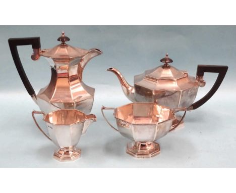 A George V silver four-piece tea service of octagonal form by Walker &amp; Hall, comprising teapot, hot water jug, sugar basi