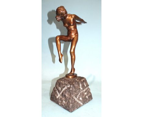 A 1920's-style polished bronze nude female figure with arms stretched behind, raised on stone plinth, 37cm high. 