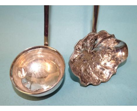 A Georgian silver toddy ladle with embossed decoration and horn handle, London 1814 and another unmarked white metal toddy la