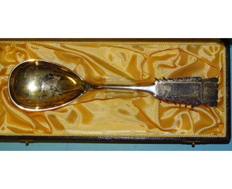 A Swedish silver Sami spoon, the bowl with etched reindeer and wolf decoration, the handle with reindeer pulling a boy on a s