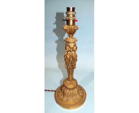 An attractive ormolu table lamp in the form of three caryatids supporting a three-footed brazier, with lion masks and raised 