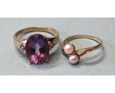 A 9ct gold ring set an oval amethyst between diamond-set shoulders, (amethyst chipped), size O, 3.9g and a 9ct gold ring set 