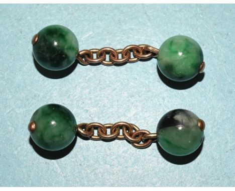 A pair of jade ball cufflinks, on unmarked chains, each ball 9.5mm diameter, 8g. 