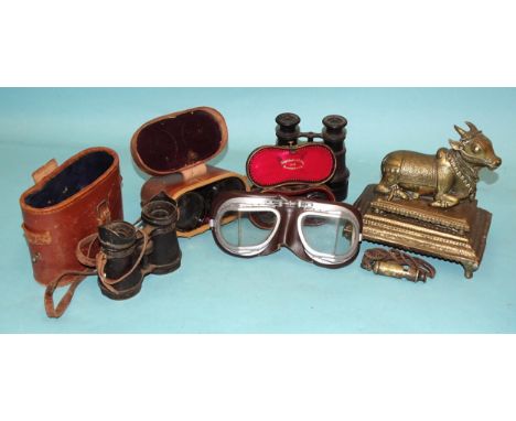 An Indian brass model of a ceremonial cow, 18cm high, 18cm long, binoculars and other items. 