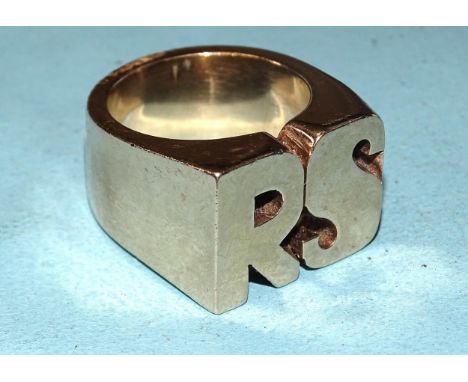 A large yellow gold ring with 'RS' motif, marked '9ct', size Z, 47.7g. 