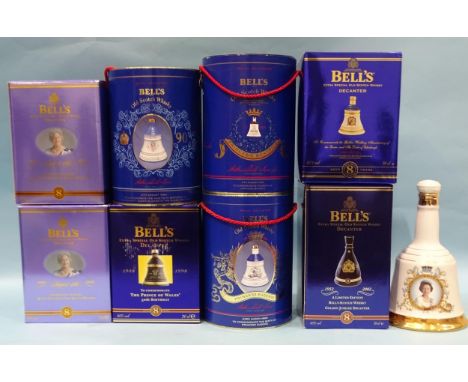 A collection of Bells ceramic commemorative whisky decanters: Queen Elizabeth the Queen Mother Centenary (x2), Prince of Wale