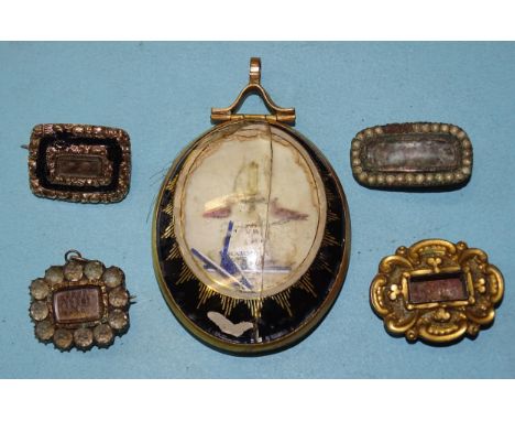 An early-19th century oval mourning pendant depicting a lamp between two doves, with hair locket to reverse, (damaged), 62 x 