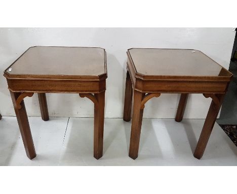 A pair of figured walnut lamp tables on chamfered supports, each 18" sq