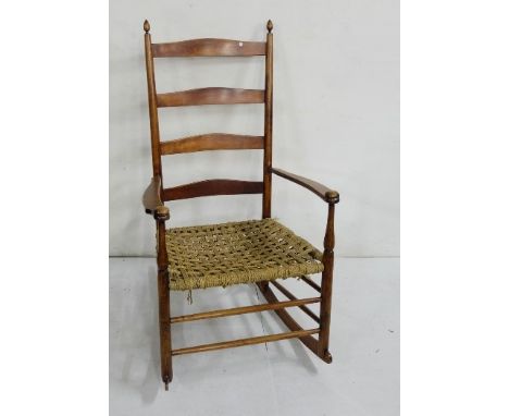 Plantation style walnut Rocking Chair, waved ladder back, with weaved rope seat, 62cm wide