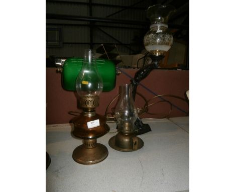 desk lamp, 2 oil lamps and a figural lamp