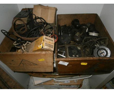 2 wooden boxes containing bakelite handles and light switches etc