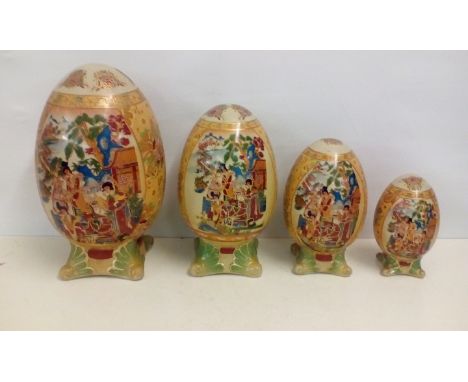 A Collection of four Graduating Ceramic Eggs