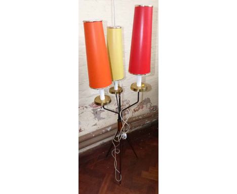 1960's black metal ware free standing lamp having brass decoration, three lamp shades of differing colours. Condition report: