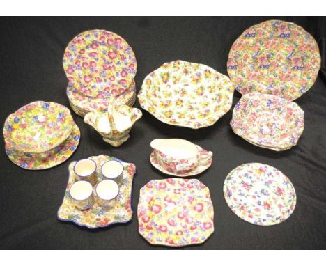 Quantity of various Royal Winton Chintz tablewares 24 pieces including plates, bowls, eggcup set, teapot stand, a basket, gra