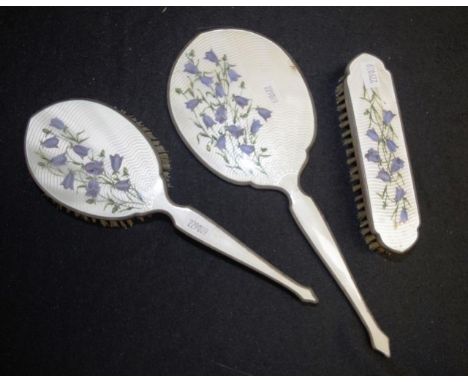 Three piece guilloche decorated dressing table set comprising matching three piece blossom decorated guilloche enamel backed 