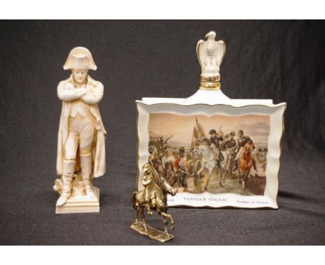 Three Napoleon related table wares comprising a French Cognac bottle (restored to stopper), a figure of Napoleon (restored to