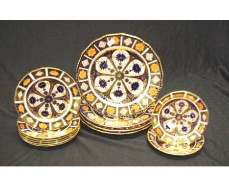 Twelve Royal Crown Derby "Imari" table wares comprising 4 dinner plates, 6 side plates, and 2 saucers