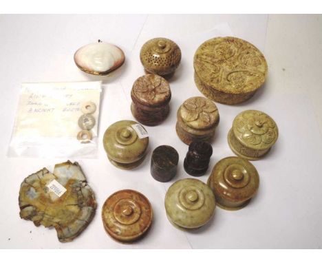 Eleven various carved stone trinket boxes together with a polished stone, 3 mesopotamia shell money rings, and a shell purse