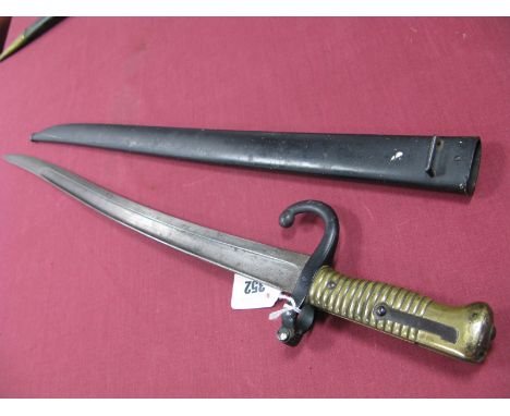 A Mid XIX Century French Chassepot Sword Bayonet, 1866 pattern, dated 1873, in its correct steel scabbard.