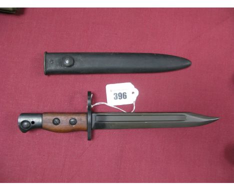 A Mid XX Century British No 5 Rifle Bayonet Dated 1946, in its black metal scabbard, very good condition.
