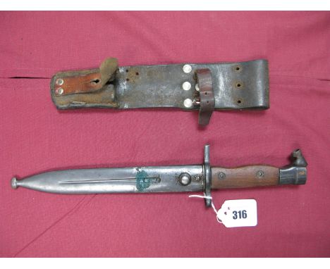 An Early XX Century Swedish Bayonet, model of 1895 but with wooden grips, blued blade 8 1/4" long, in its steel scabbard with