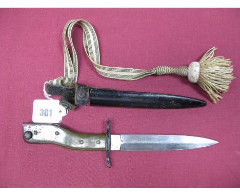 An Early XX Century German Fighting Knife/Bayonet Manufactured By Gesetzlich , in black metal scabbard and including bayonet 
