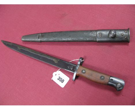WWII India Pattern Bayonet, the blued blade stamped "GR Mark II" and dated 1942, in its correct black leather scabbard with m