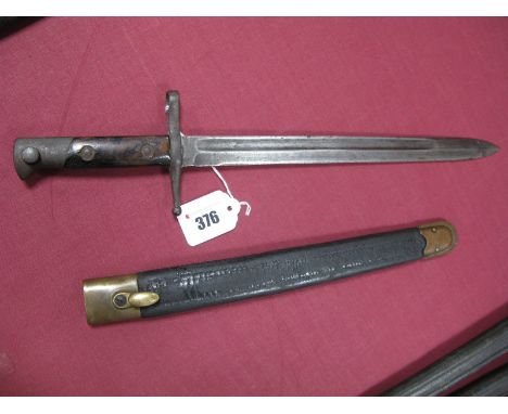 A Late XIX Century Italian Carcano Bayonet Model 1891, blade 113/8" long with rust pitting, in its black leather scabbard wit