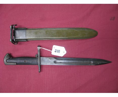 A WWII American Bayonet for the Garand Rifle, blade dated 1942, in its correct green plastic scabbard with metal fittings, wi