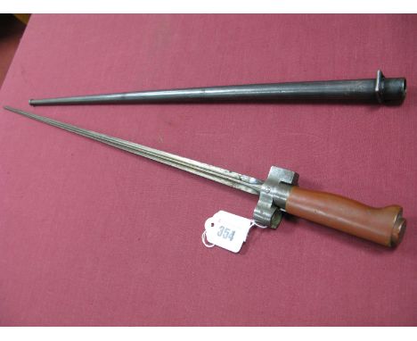 A Late XIX Century to Early XX Century French Model 1886/93/16 Bayonet, the blade of cruciform shape and 20½" long, the hilt 