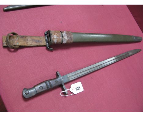 WWI American 1917 Dated Bayonet by Remington, 16 3/4" long blade in dull condition. In its correct green leather scabbard wit