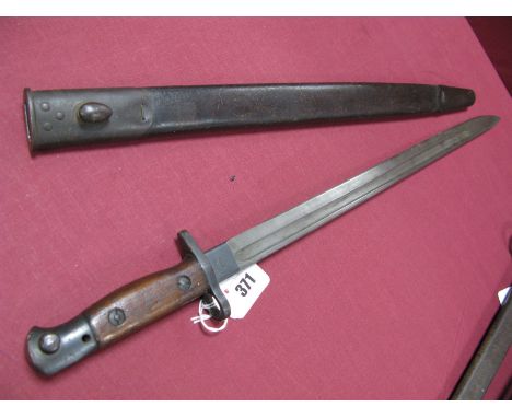 An Early XX Century British 1907 Bayonet, by Sanderson, in its brown leather scabbard with metal fittings, very good conditio