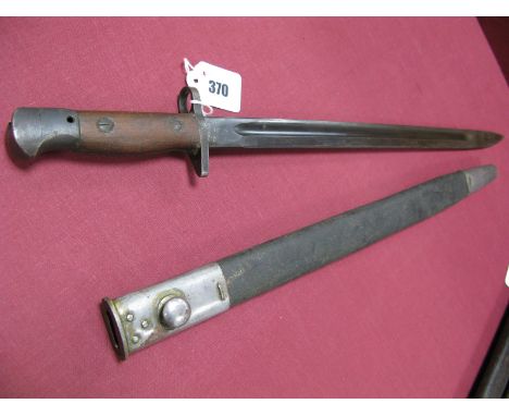 An Early XX Century British 1907 Model Bayonet, with 17" blade marked with 1907 and W.D. Arrow etc. plain wooden grips and in