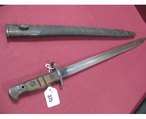 An Early XX Century American 1907 Model Bayonet, with 17" blade dated 1907 etc, in its black leather scabbard with metal fitt
