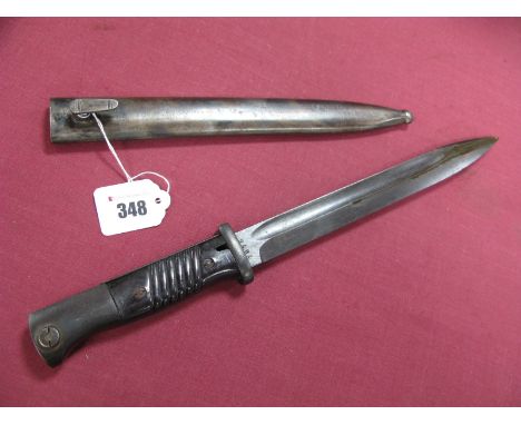 A German Third Reich Period Mausser K98 Bayonet, with plastic grips, in its correct metal scabbard.