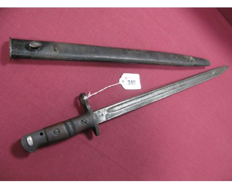 WWI American 1917 Dated Bayonet by Winchester, in its black leather scabbard with metal fittings, in average condition.