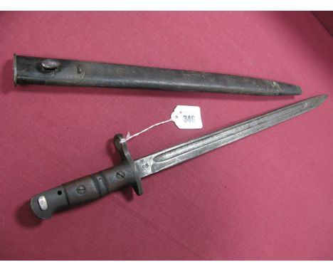 WWI American 1917 Dated Bayonet by Winchester, in its black leather scabbard with metal fittings, in average condition.