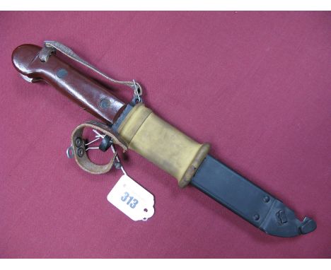 A Late XX Century Russian AK47 Bayonet, with 5.7/8" blade with wire cutter slot and saw back, with its red plastic grips in i