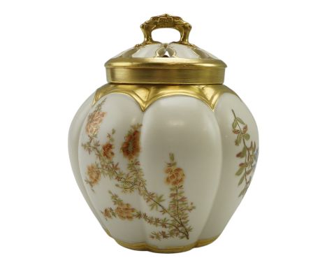 A late 19th Century Royal Worcester gilt-enriched potpourri pot decorated in a floral pattern, height 20 cm