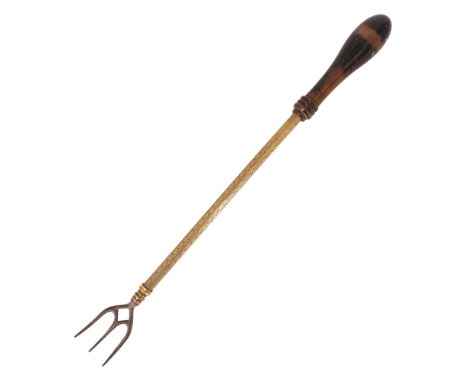 A Victorian brass and iron telescopic toasting fork having a turned ebonised handle, max length 56 cm