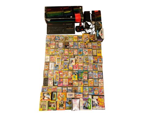 A boxed 1980s Sinclair ZX Spectrum +2  gaming console together with Cheetah 125+, The Cruiser Power Play, The Bug joysticks a
